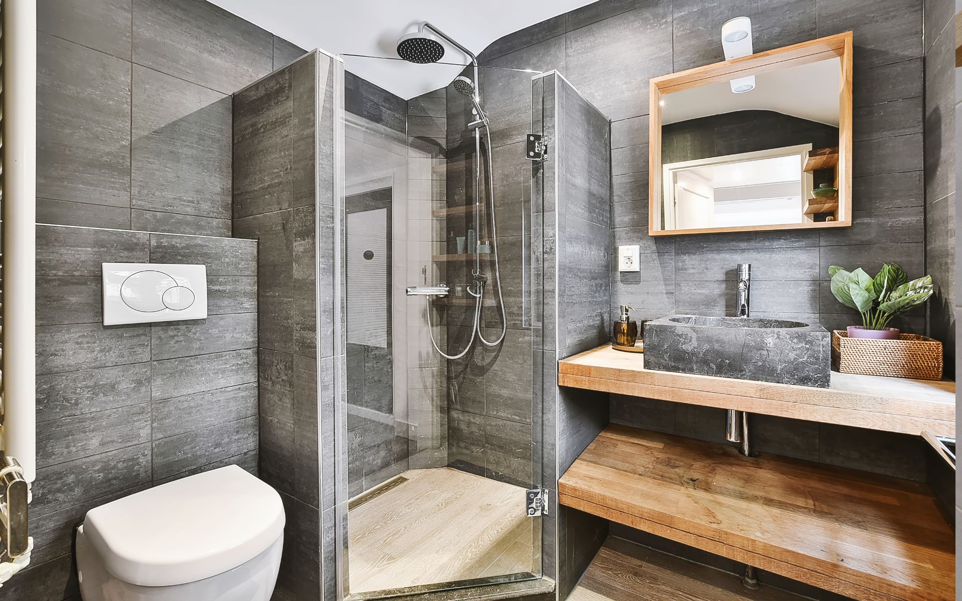 Bathroom with open shelving, shower and toilet