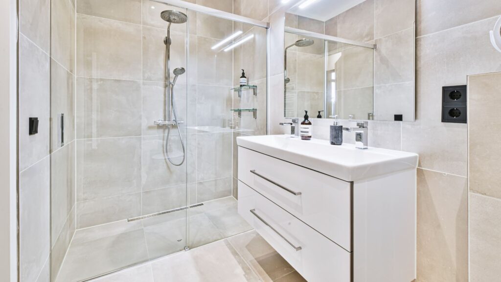 White small bathroom with floating vanity and a shower