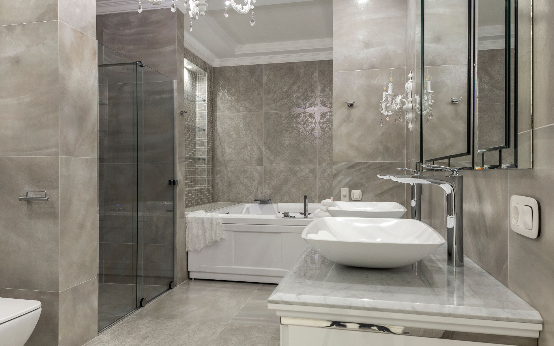 Elegant bathroom with vessel sinks, tub and shower