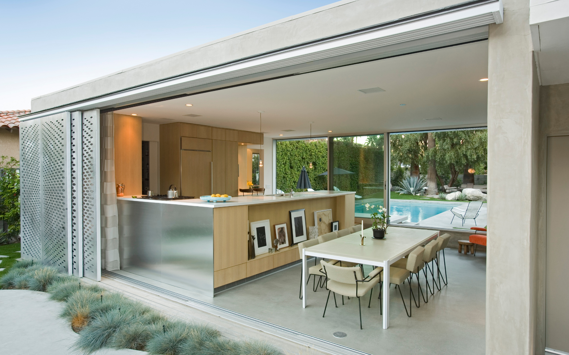 Modern style outdoor kitchen beside pool