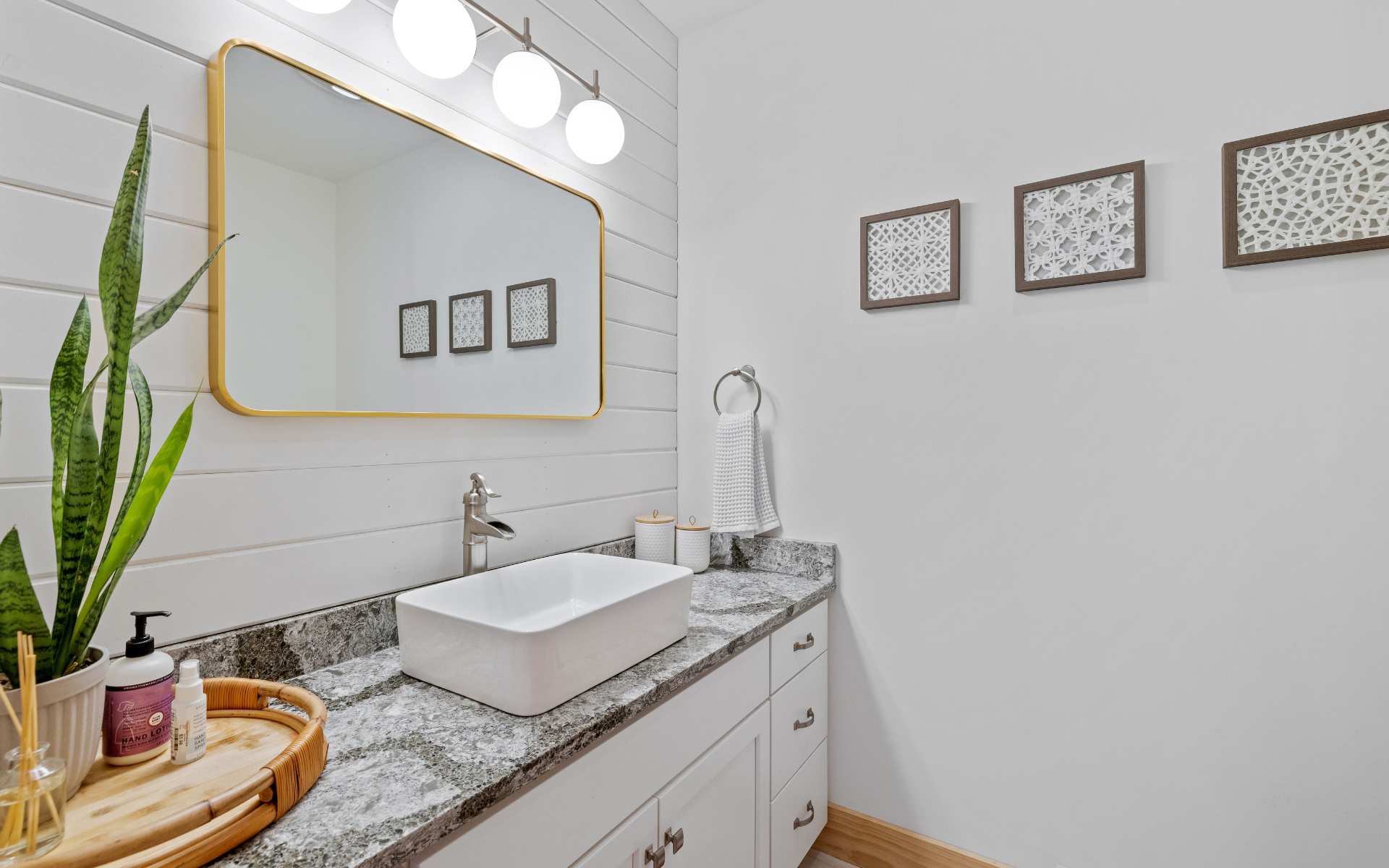 Elegant white bathroom vanity with granite countertop