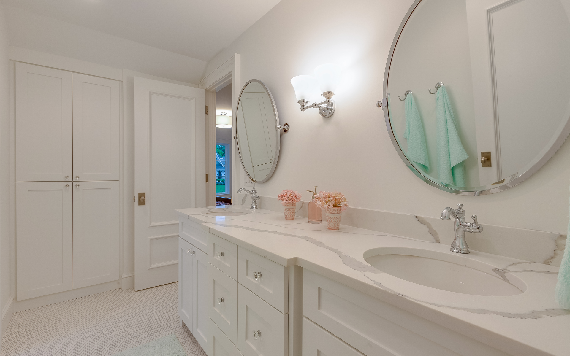 White bathroom vanity with quartz countertop