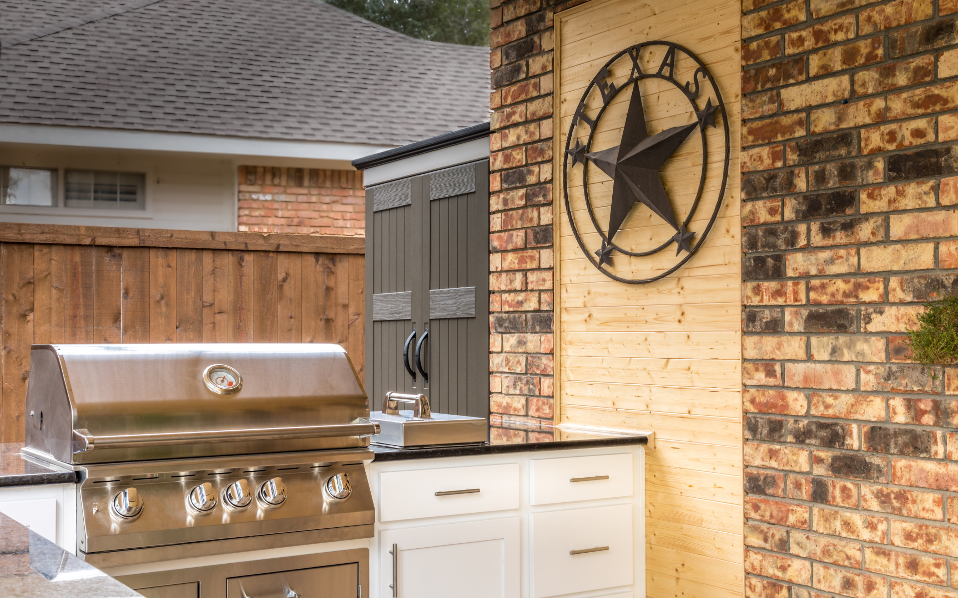 Outdoor kitchen with white shaker cabinets