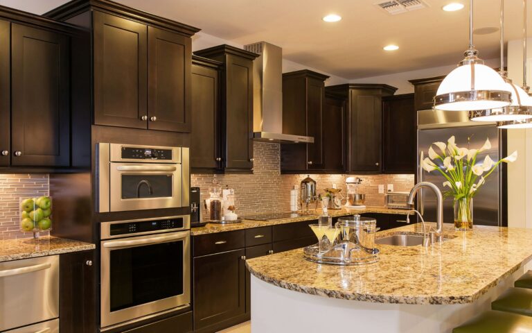 Traditional kitchen cabinet styles with Dark brown cabinets