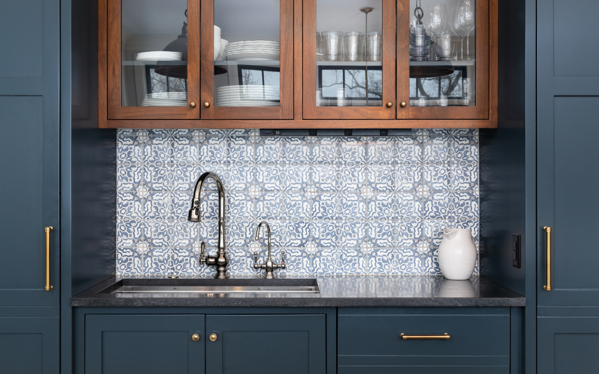 Kitchen with Navy cabinets and moroccan floor tile backsplash