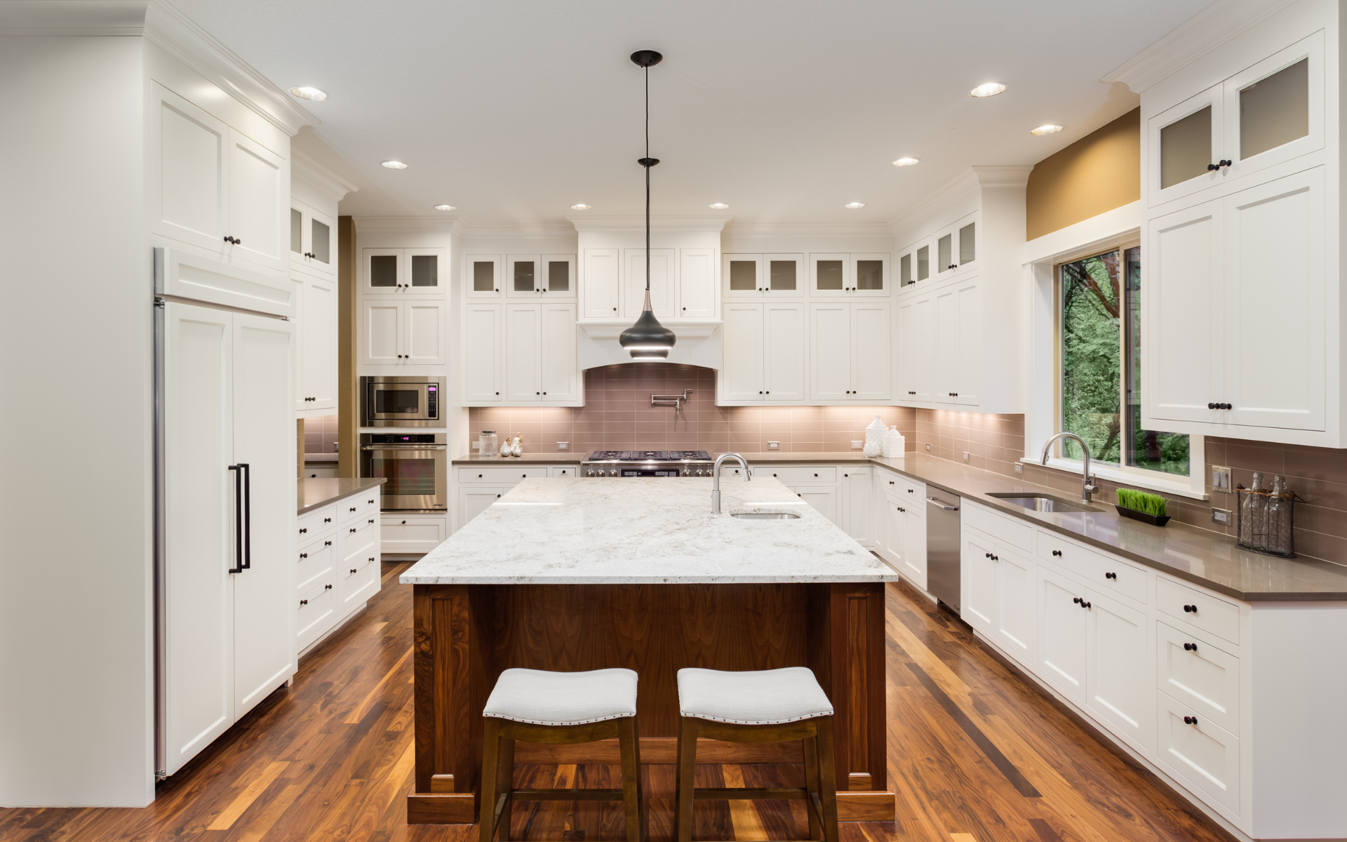 Spacious U shape kitchen with white inset cabinets