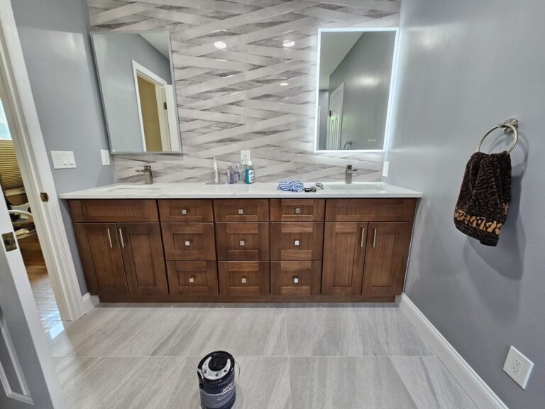 Modern Bathroom Remodeling in Morristown NJ with walk-in shower, double sink brown shaker vanity, silver hardware, and white quartz countertop