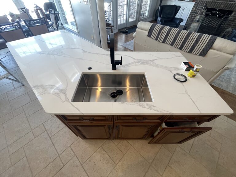 Luxury kitchen remodel with brown traditional cabinets and white quartz countertop