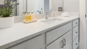 Grey bathroom cabinet with white countertop
