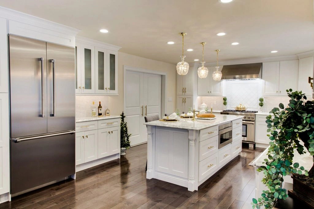 Spacious white kitchen design with white kitchen island top