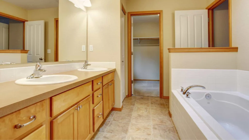 Traditional bathroom cabinet style in classic oak cabinet and beige countertop