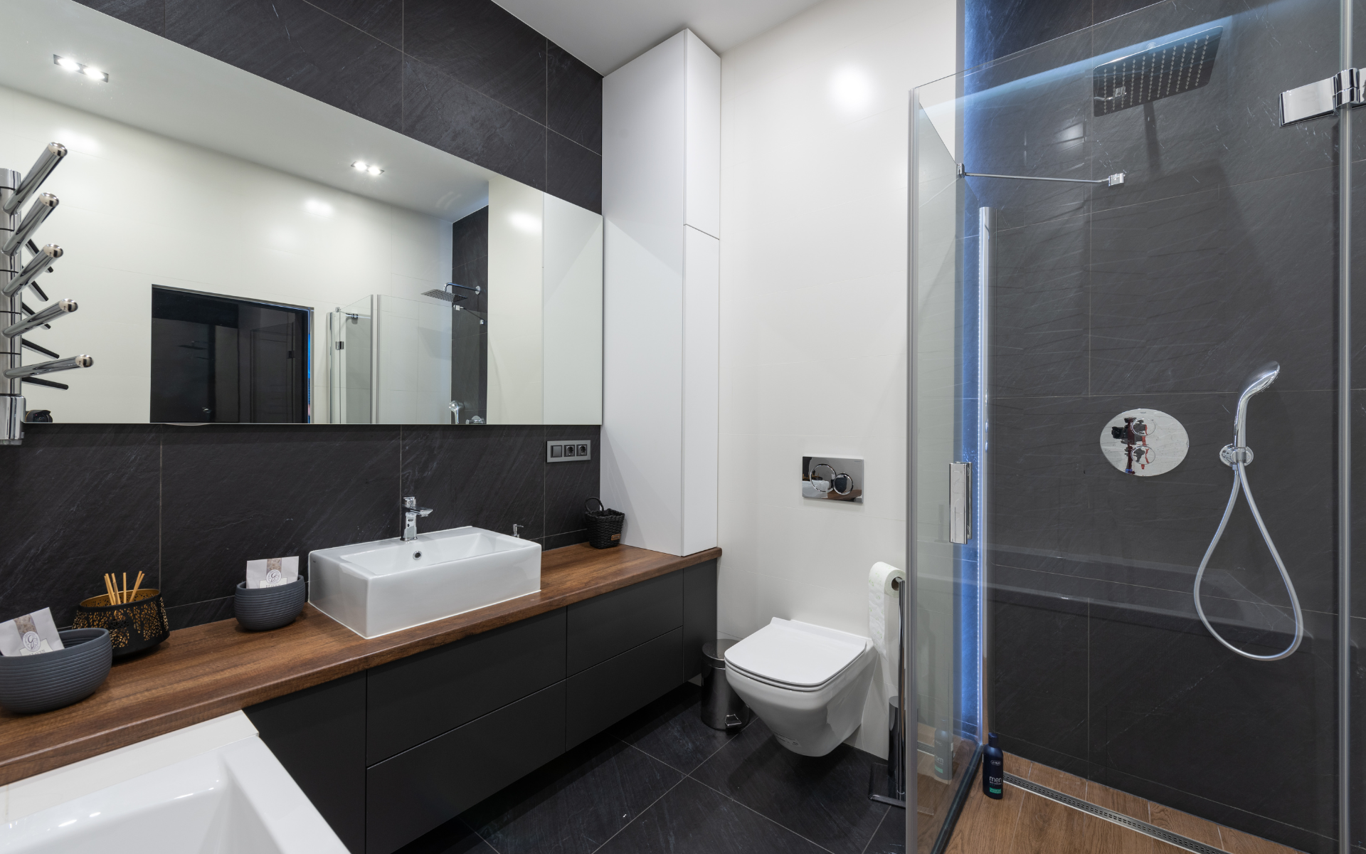 Elegant bathroom style with floating toilet, vanity, and shower