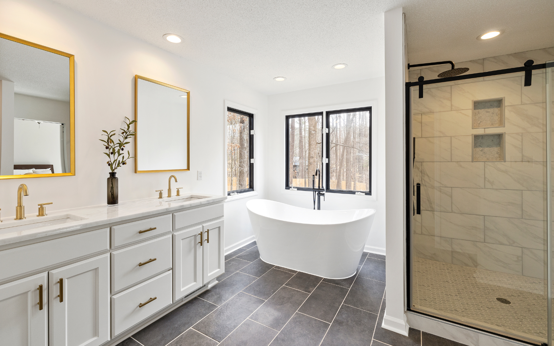 Spacious bathroom with double sink vanity, tub and shower