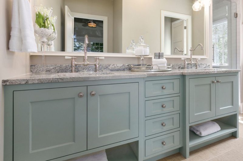 Gray transitional bathroom cabinet with white countertop