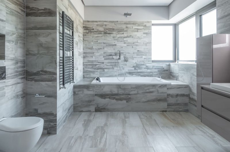 Grey bathroom cabinets on grey themed bathroom design for a taste of modern look