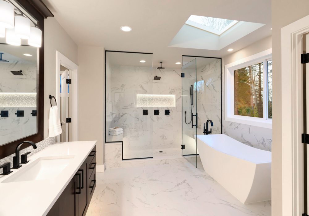 White Kitchen Bathroom with luxury bath tub, shower and vanity, surrounded by porcelain tiles
