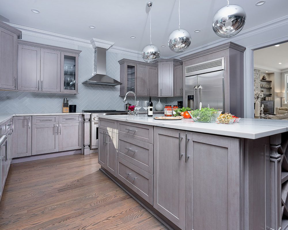 Fabuwood Grey kitchen cabinets with white countertop